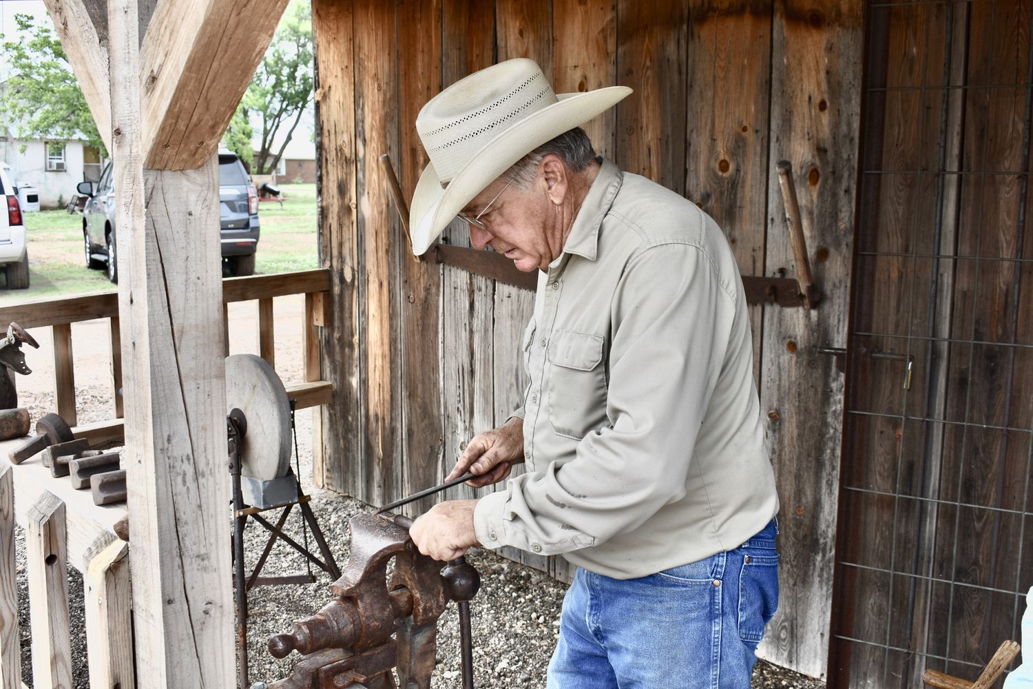 Blacksmith Cotton Elliot making metal bracelets