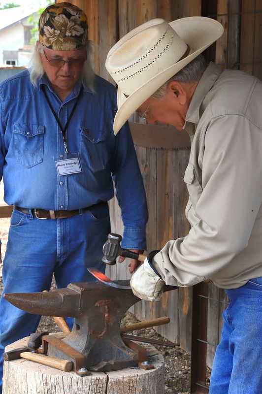 Blacksmith Cotton Elliot (front) and helper Rusty Etheredge. (Photo by Julie Childs)